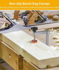 Twofer Pack Aluminum Bench Dog Clamps with Hand Operated Knob on woodworking bench with plane, securing wood piece.