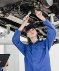 A mechanic using a Quarter Inch Ratchet Socket Wrench With Quick Grip For Easy Bolt Fastening And Smooth Auto Repair Work.