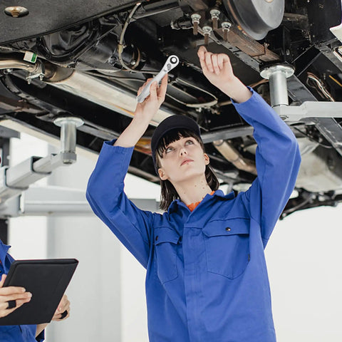 A mechanic using a Quarter Inch Ratchet Socket Wrench With Quick Grip For Easy Bolt Fastening And Smooth Auto Repair Work.