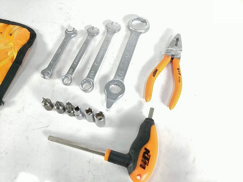 Genuine Motorcycle Tool Kit For Dirt Bikes And Sport Bikes OEM Quality Handy Tools In A Durable Carry Case displayed on a table.