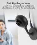 Mounted 1080P Indoor Security Camera Set, 2 Pack Full HD WiFi Surveillance Cams With 2 Way Audio on wall, woman in background