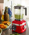 Cord Organizer For Kitchen Appliances 12 Pack Cable Storage Wire Holders To Keep Small Appliances Decked Out Like Mixer Coffee Maker Air Fryer And Pressure Cooker In Black Grey And White shown on a red blender with green smoothie on kitchen counter
