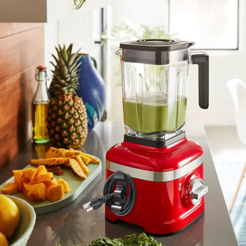 Cord Organizer For Kitchen Appliances 12 Pack Cable Storage Wire Holders To Keep Small Appliances Decked Out Like Mixer Coffee Maker Air Fryer And Pressure Cooker In Black Grey And White shown on a red blender with green smoothie on kitchen counter