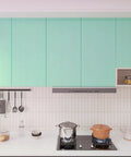 Thick Pastel Mint Metallic Peel And Stick Wallpaper With Brushed Matte Surface Gives Your Space A Straight Up Glow Up self-adhesive backsplash in modern kitchen.