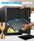 Person removing shelf from 2.5 Cu Ft Fireproof Safe Box For Home Documents With Type C External Power And Electronic Keypad Steel Security Safe With Sensor Light Removable Shelf Ideal For Cash Jewelry And Valuables next to a tablet and trophy.