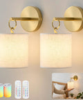 Zero Drilling Required, Battery Operated Wall Sconces Set Of Two With Remote, Brushed Gold Wireless Hanging Lamps in a warm-lit room.