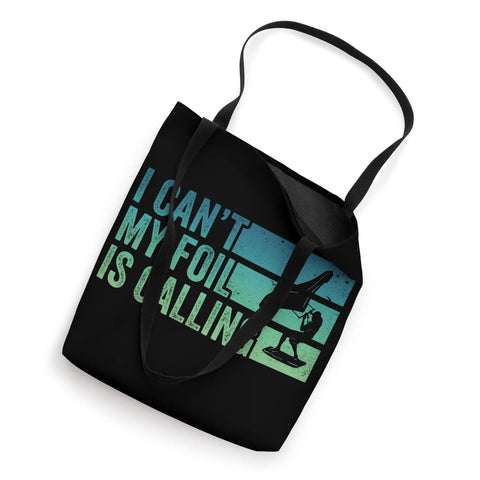 I Cant My Foil Is Calling Wing Foil Wingsurfing Tote Bag, black, 16x16 inch with printed design and black straps.