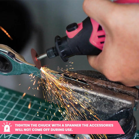 Rock Solid Corded Rotary Tool Kit With 180 Watt Motor Variable 8000 To 35000 Rpm in action grinding metal with sparks flying.