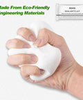 Hand holding Six Pack Waterproof Sealant Mastic White Repair Clay for Walls and Surfaces Cement Crack Filler Patch Up Quick Mending Mud.
