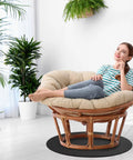 Woman relaxing on recliner using Two Pack 27.25 Inch Round Non Skid Rubber Furniture Pads For Recliners And Swivel Chairs.