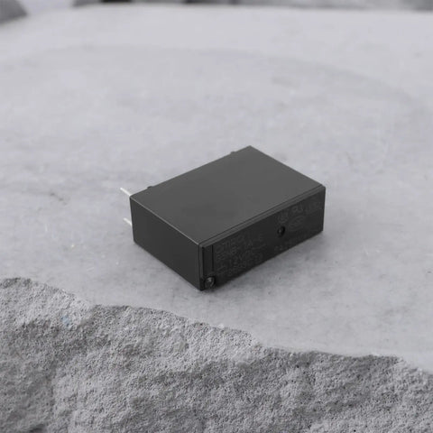 12V DC Relay Module With SPST NO Contact, 5A 250V AC Load Switching, G5NB 1A E 12VDC Version on a textured surface