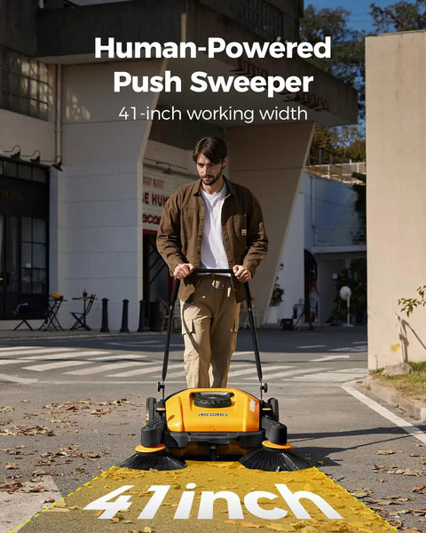 Kick Serious Dust With This Heavy Duty Manual Floor Sweeper Designed For Warehouses And Shops Featuring A 41 Inch Wide Commercial Push Broom That Runs Whisper Quiet And Cuts Through Grit Fast, shown in use outdoors.