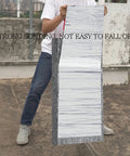 Heavy Duty Self Adhesive Flashing Tape Waterproof Roof Patch With Aluminum Foil Backing For Leak Repair Ice And Water Shield being held outdoors.