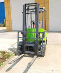 Portable Electric Forklift 4Way Mini Lift Truck With Adjustable Reinforced Forks Solid Tires ergonomic seat at warehouse entrance.