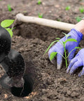 4x12 in garden auger drill bit for planting; purple-gloved hands guide a seedling into a soil hole.