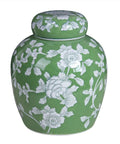 Slick Green And White Ceramic Tea Canister With Secure Airtight Lid featuring hand-painted floral design and rounded shape.