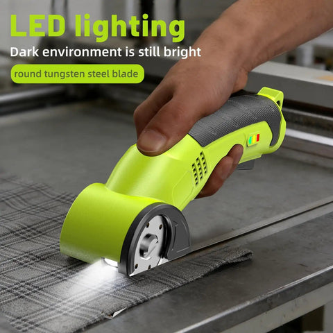 Cordless Electric Scissors For Cardboard Fabric Leather And Carpet With Two Blades Safety Lock And Storage Case shown cutting fabric with LED light