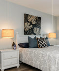 2 Pack Plug In Pendant Lights With 15Ft Clear Cord Toggle Switch Beige Linen Shade Modern Hanging Lamp over a styled bedroom.