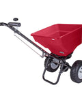 Red Pro Grade Heavy-Duty 100 Lb Broadcast Fertilizer Spreader with 13 Inch Pneumatic Tires and Enclosed Gearbox, side view.
