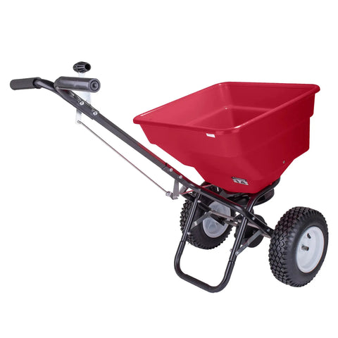 Red Pro Grade Heavy-Duty 100 Lb Broadcast Fertilizer Spreader with 13 Inch Pneumatic Tires and Enclosed Gearbox, side view.