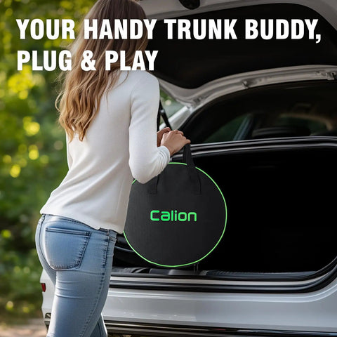 Woman holding a black Calion trunk organizer bag while leaning into a car trunk, showcasing its convenient plug and play feature.
