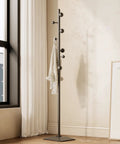 Freestanding Coat Rack With Seven Hooks And Sturdy Metal Base For Bags Hats And Coats Built To Last With High Temperature Paint And All Metal Construction No Wobble For Home Hallway Or Office shown in modern living room.