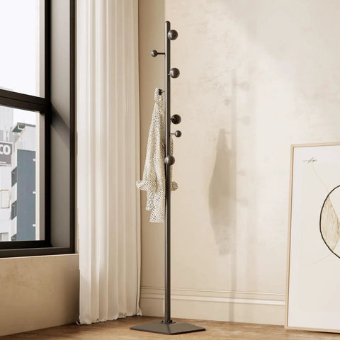 Freestanding Coat Rack With Seven Hooks And Sturdy Metal Base For Bags Hats And Coats Built To Last With High Temperature Paint And All Metal Construction No Wobble For Home Hallway Or Office shown in modern living room.