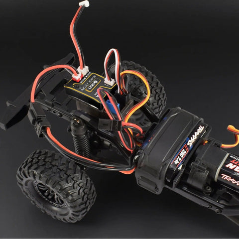 Beefy 25A Waterproof Micro Brushed ESC installed in RC crawler chassis, ideal for SCX24 1x24 and TRX4M 1x18 models, 2-3S LiPo ready.