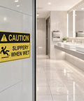 Caution Wet Floor Sign Set 10 X 7 Inch Two Pack Vinyl Sticker With High Visibility Reflective Waterproof Finish, Fade-Resistant Slippery When Wet Warning Decal For Commercial Kitchens, Offices, Warehouses And Restaurants on restroom wall