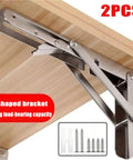 Heavy Duty Stainless Steel Folding Shelf Brackets Set mounted under wooden shelf with screws visible, strong load-bearing capacity