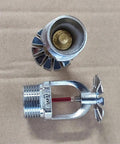 Rock-Solid Pendent Fire Sprinkler Head With Quick Response 155 Degrees Activation And Chrome Finish showing chrome head and brass interior.