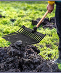 Person using Beefy Pair Heavy Duty Horse Manure Fork Heads For 1 Inch Handles Workhorse Pitchfork Replacement Heads outdoors.