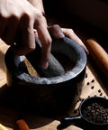 Grinding spices in Granite Mortar And Pestle Set With Gold Metal Base, Two Cup Capacity, Crush Spices, Nuts And Herbs