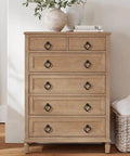 Wooden dresser with metallic handles, topped with pottery and books, featuring Gold Zinc Alloy Cabinet Knobs For Kitchen And Bathroom.