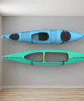 Slick Wall Mount Kayak Rack And Universal Garage Storage Hooks For Quick Gear Stash Out keeps two kayaks securely mounted on a wall.