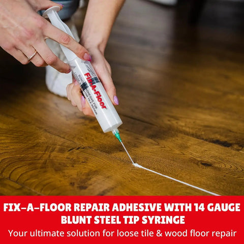Two Pack Loose Tile Repair Adhesive With Syringe For Tile Porcelain Ceramic Marble Stone And Wood Floors Extra Strength Bonding that Rebounds Loose Or Hollow Tiles Without Demolition being applied to wood floor using syringe
