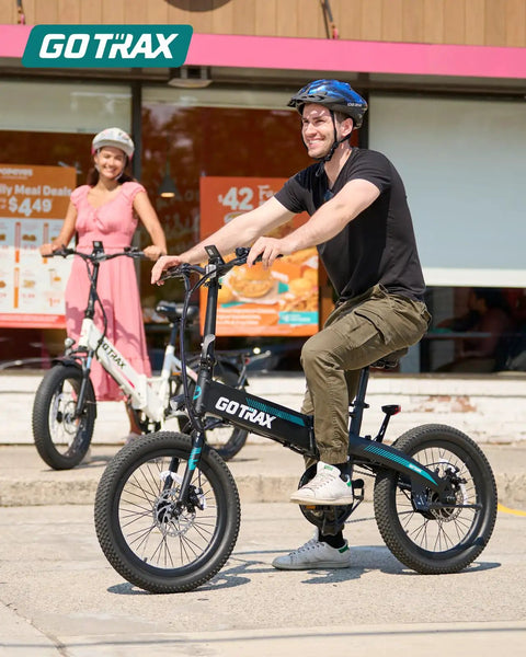 Man riding Foldable Electric Bike With 20 Inch Wheels For Daily Commutes And City Cruising 40 Mile Range 48V Battery 350W Motor