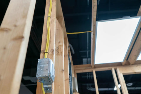 SIMpull Solid Indoor NM-B Cable 10/2 With Ground Copper Wire For DIY home wiring through a wooden frame to a metal box.