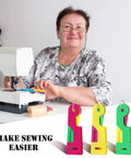 Must Have 46 Piece Sewing Tools Kit With 9 Automatic Needle Threading Devices shown with woman sewing and colorful threaders