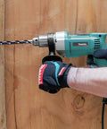 Person using Heavy Duty Half Inch Corded Drill With 6.5 Amp Motor And Variable Speed 0 To 550 RPM for wood drilling