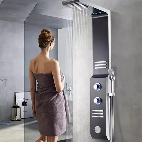 Ultra Slick Wall Mounted Bathroom Shower System Featuring Handheld Sprayer LED Ambient Light, modern design with water flowing.