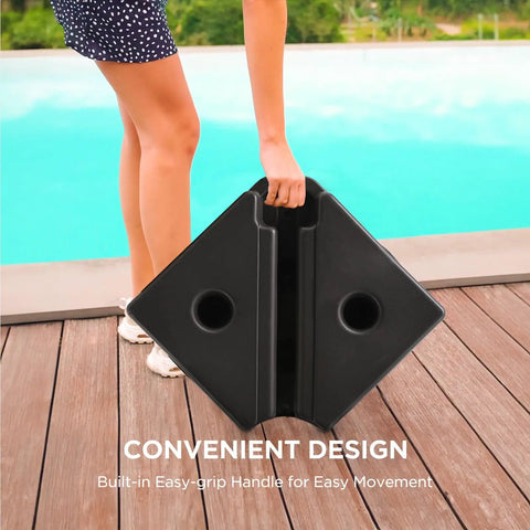 Heavy Duty 4 Piece Patio Umbrella Base Weights 220 Lbs Fillable With Water Or Sand Square Base being carried by person on deck