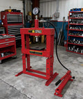 Beefy 10 Ton Welded H Frame Shop Press With Adjustable Crossbeam and 12 Inch Stroke in a workshop setting.