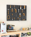 Four Piece Twelve By Sixteen Inch Metal Pegboard Panels Built Tough For Your Garage, Workbench And Shop, Modular Wall Mounted Pegboard With One Eighth Inch And One Quarter Inch Holes, Black, mounted on wall holding tools.