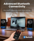 Desktop Speaker System With 2.75 Inch Full Range Drivers And Bluetooth 6.0 shown with laptop and smartphone on wooden desk