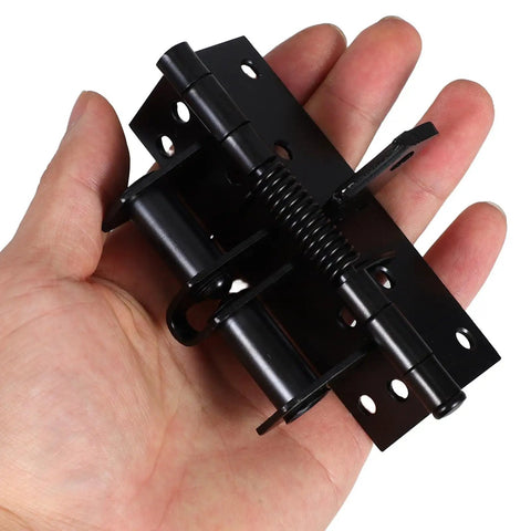 Hand holding black Two Pack Self Closing Door Hinges With Adjustable Tension And 90 Degree Rotation for offices and shops