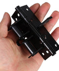 Hand holding adjustable spring door closer hinges with 90 degree self closing zinc alloy construction prevent slamming fits multiple door thicknesses