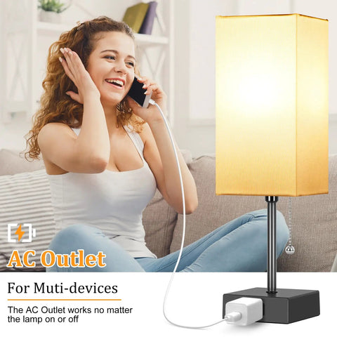 Woman smiling while using phone near Set Of 2 Minimalist Table Lamps With AC Outlets For Bedroom, Cozy Night Light Vibe, Bulbs Included.