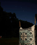 Two Sided Archery Bag Target Built For 425 FPS Practice with bright high visibility aiming points under night sky, heavy duty handle