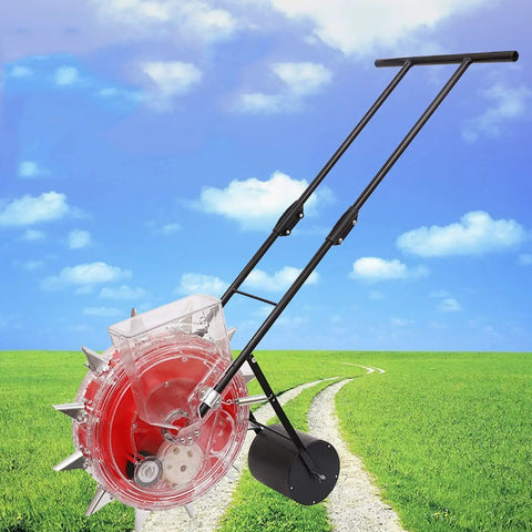 Metal Precision Garden Push Planter With 9 Hole Seed Sower on a path in a green field